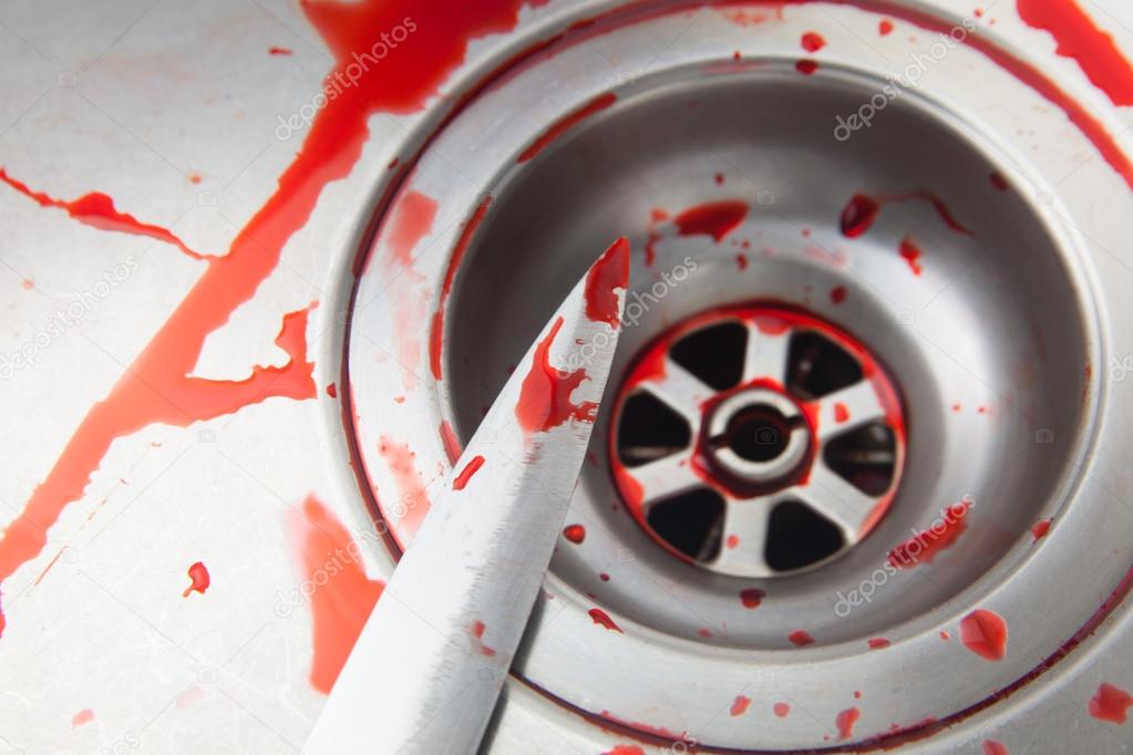blood and knife in the sink