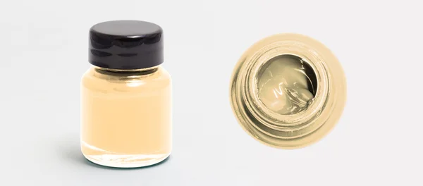 Navajowhite lado garrafa de cor acrílica e vista superior isolado branco — Fotografia de Stock
