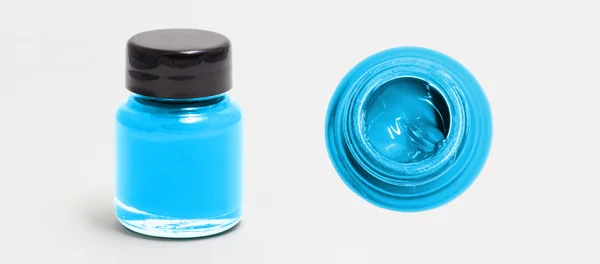 Tiefhimmelblau Acrylfarbe Flasche Seite und Draufsicht weiß isolieren — Stockfoto