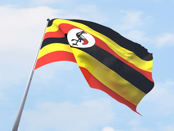 Uganda flag flyver på klar himmel . - Stock-foto