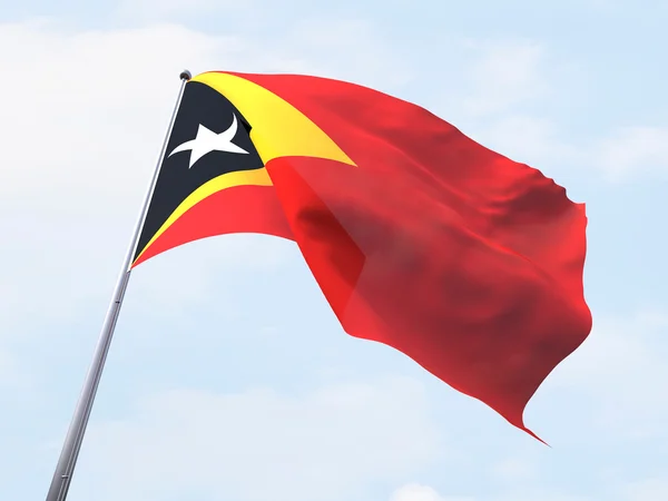 东帝汶旗帜迎风飘扬在晴朗的天空. — 图库照片