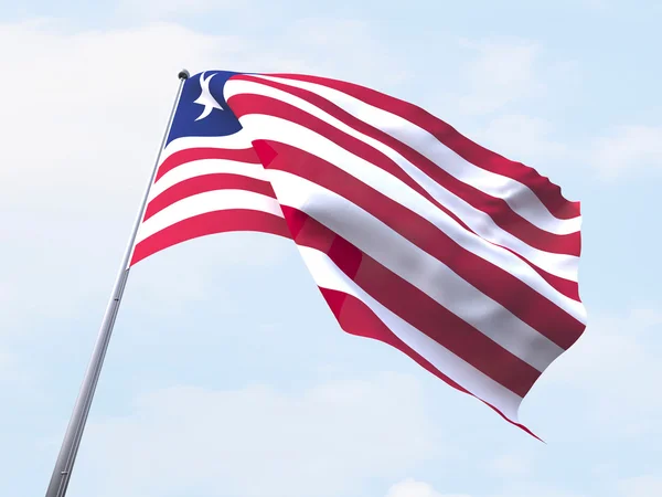 Bandeira da Libéria voando no céu limpo . — Fotografia de Stock