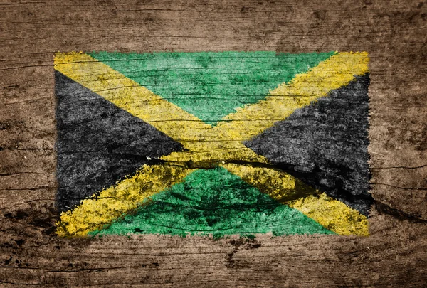 Bandiera giamaicana dipinta su fondo legno — Foto Stock