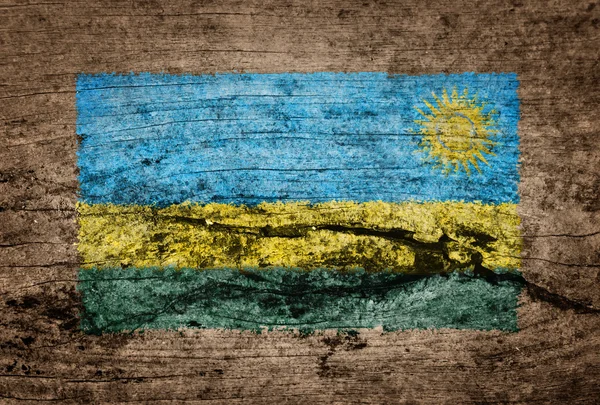 Ruandan lippu maalattu puupohjalle — kuvapankkivalokuva