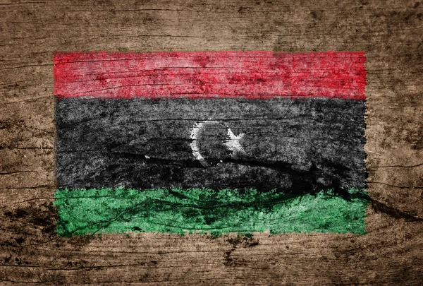 Ahşap arka plan üzerine boyalı Libya bayrağı — Stok fotoğraf