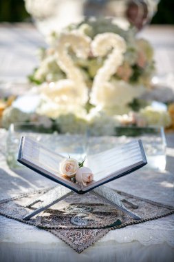 Book Of Poetry set on a decorated table for a Persian wedding ceremony clipart