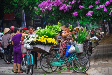 Vietnam florist vendor on hanoi street, Vietnam.  This is small market for vendors of hanoi, vietnam. clipart