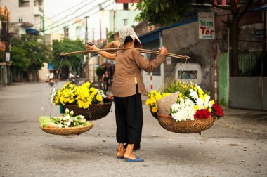 Vietnam florist vendor on hanoi street, Vietnam.  This is small market for vendors of hanoi, vietnam. clipart