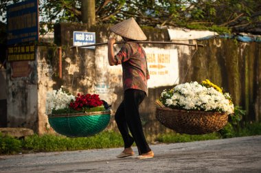 Vietnam florist vendor on hanoi street, Vietnam.  This is small market for vendors of hanoi, vietnam. clipart