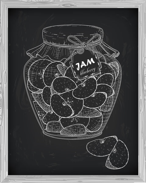 beautiful jar of homemade jam with apple on a black background