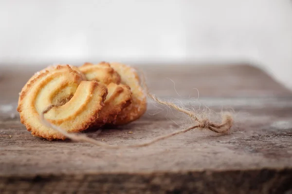 Печиво з маслом крупним планом на дерев'яному фоні — стокове фото