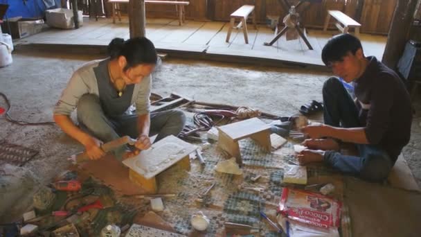 Woman and man produces wood souvenirs — Stock Video