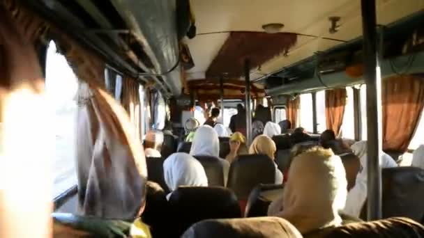 Interior of the bus with pilgrims — Stock Video