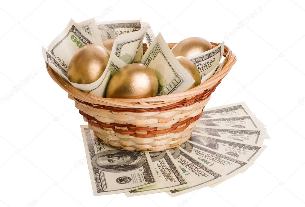 golden eggs and dollars in a basket isolated