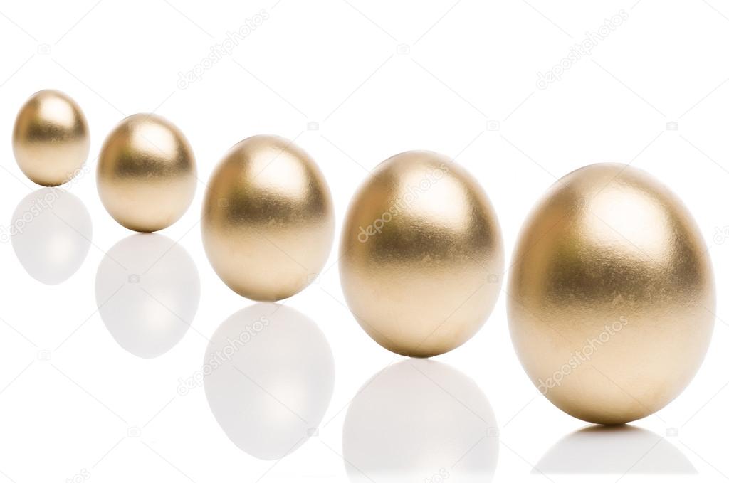 Golden eggs from  isolated on a white background.