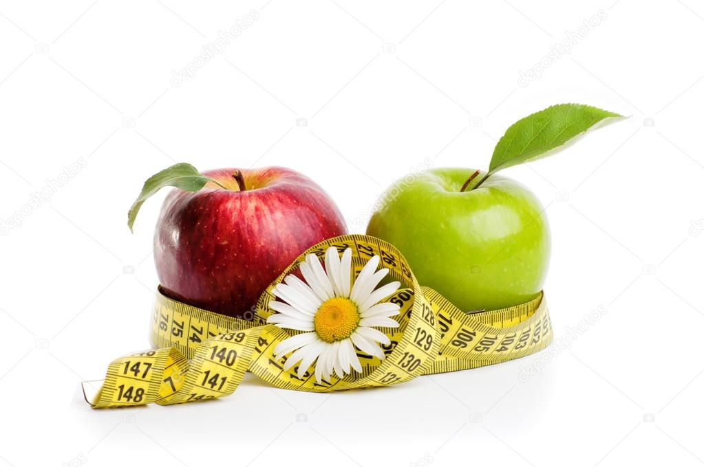 Apples, flowers and measuring tape.