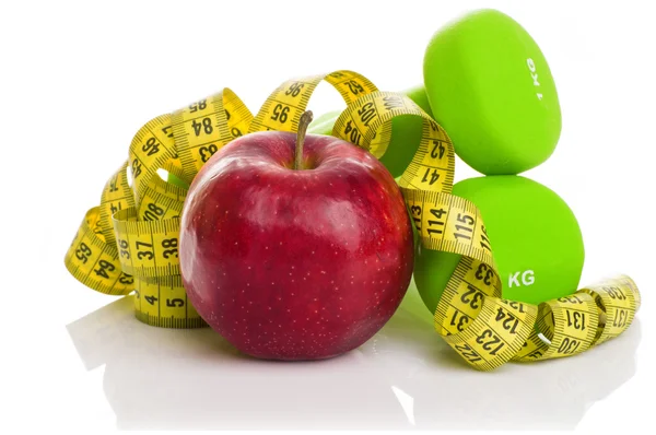 Dos pesas, manzana roja, cinta métrica . — Foto de Stock