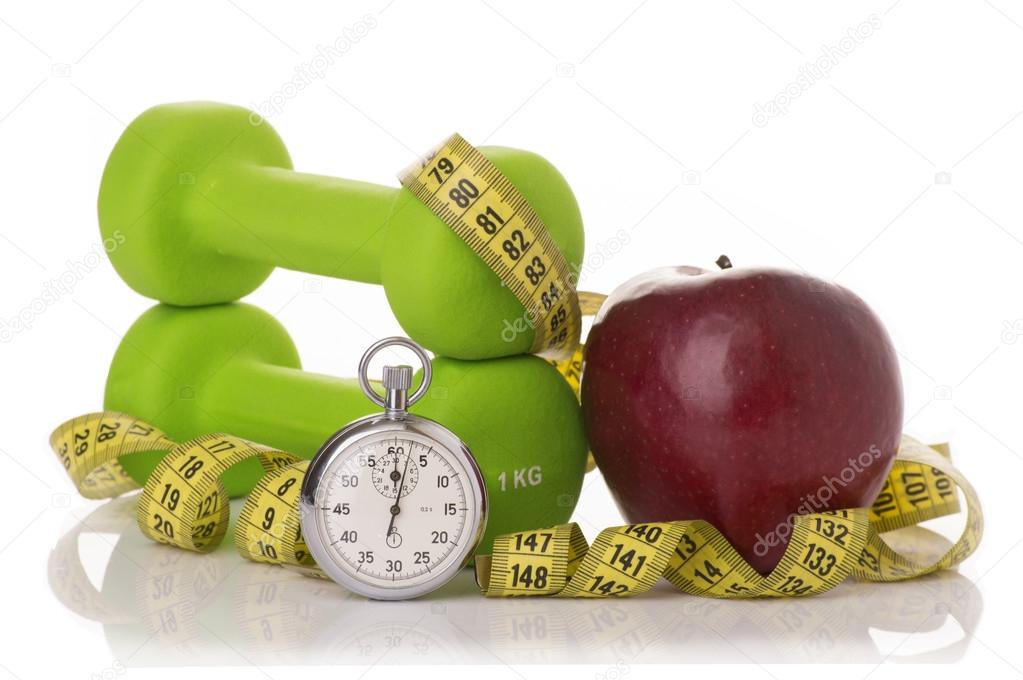 Two dumbbells, red apple, measuring tape.