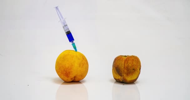 Peach rotting time lapse, the concept of plant ginetic modification, medical rejuvenation of the body, various cosmetic procedures — Stock Video