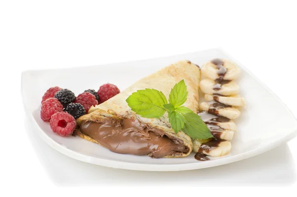 Crepes with chocolate cream and banana — Stock Photo, Image