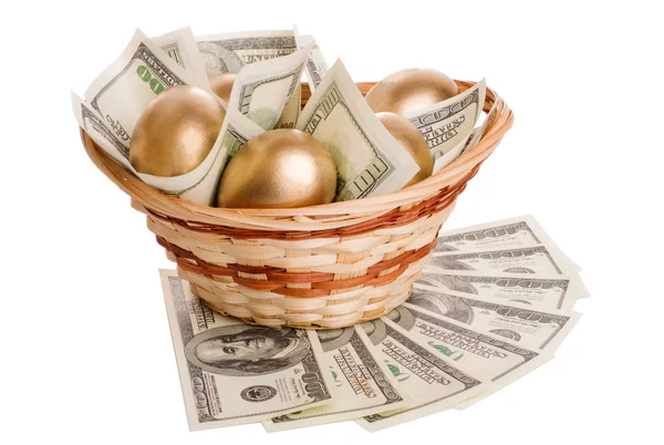 Golden eggs and dollars in a basket isolated — Stock Photo, Image