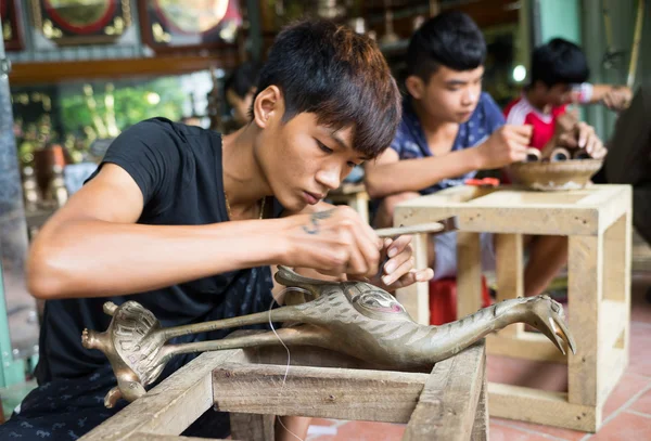 Junior craftsmen making copper handicraft products — Stock Photo, Image