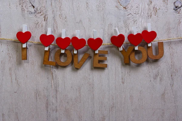 Wood letters and heart forming phrase I LOVE YOU — Stock Photo, Image