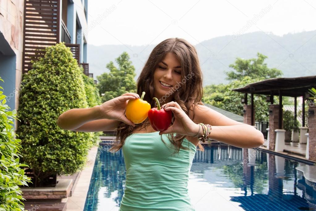 Detox diet. Helthy girl with pepper in her hands