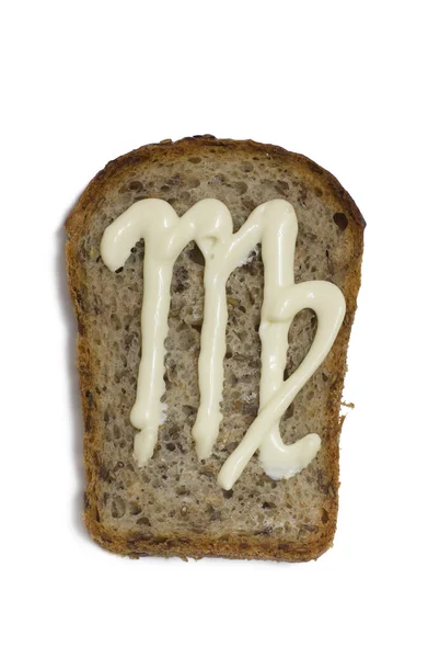 Símbolo el virgo se dibuja con mayonesa en un pedazo de pan Fotos De Stock Sin Royalties Gratis
