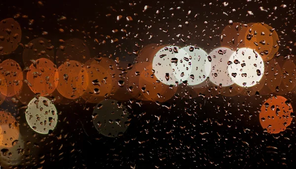 Night city lights in rain — Stock Photo, Image