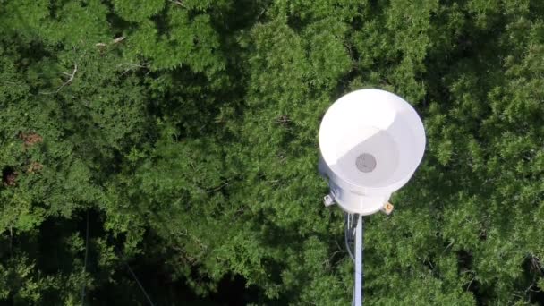 Rain gauge water aerial rainfall shot tower forest wood science research scientific weather meteorology funnel falling atmospheric onto precipitation measurement equipment station plastic machine — Vídeo de stock