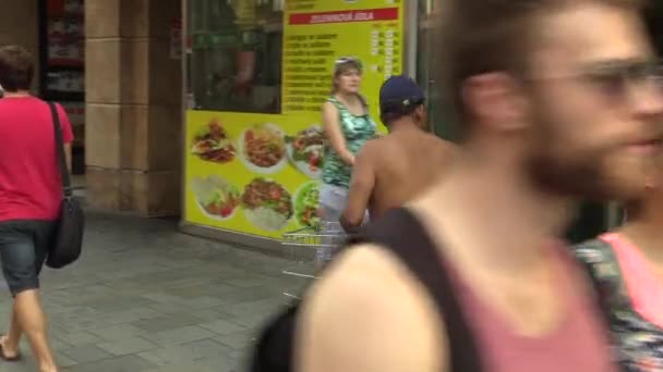 BRNO, CZECH REPUBLIC - SEPTEMBER 1, 2015: Authentic homeless man driving with a shopping cart down the street, town Brno, South Moravia, Czech Republic, Europe, EU — Stock Video