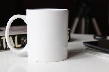 White cup on a table