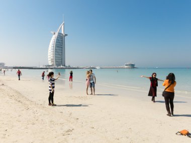 Jumeirah Beach and Burj al Arab Hotel in Dubai clipart