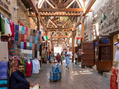 The famous textile souk in Bur Dubai clipart