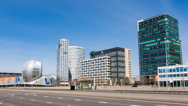 AMSTERDAM, NETHERLANDS - MAR 22, 2015: AMSTERDAM, NETHERLANDS: MARCH 22, 2015: Amsterdam business disctrict Zuid-oost with office buildings Living Tomorrow, Alpha Tower, Oval Tower and Entree II Tower, Netherlands