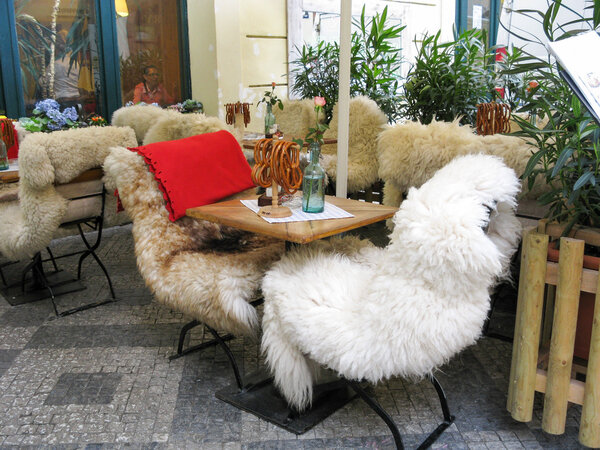 Chairs covered with fur skins, Prague