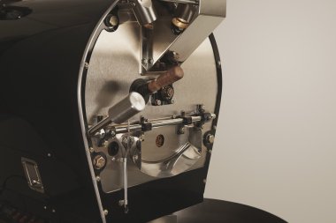 Best professional coffee roasting machine at work closeup