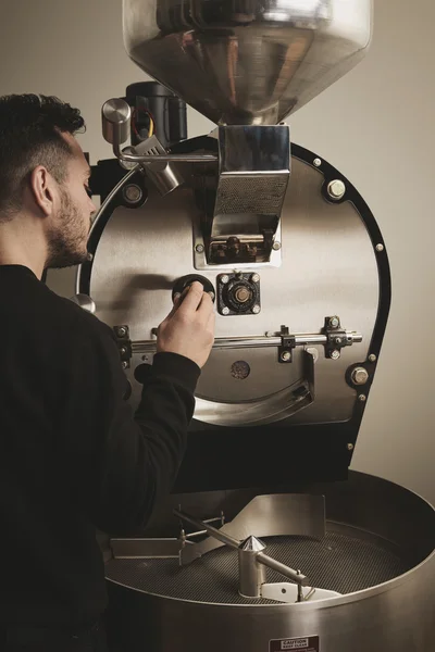 Professional barista takes first probe from coffee machine — Stock Photo, Image