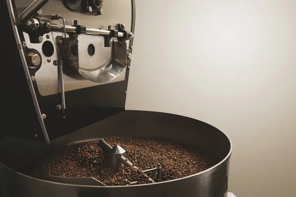 Freshly baked coffee beans best professional roasting machine — Stock Photo, Image