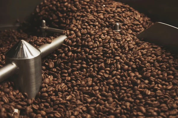 Beans freshly baked  hot cool down inside roasting machine — Stock Photo, Image