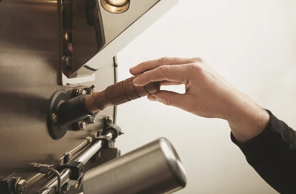 Work hand is ready take probe roasted coffee beans — Stockfoto