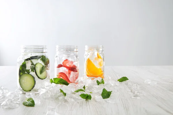 Orange,strawberry,cucumber and mint lemonades — Stock Photo, Image