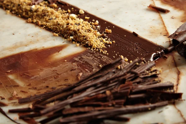 Melted homemade chocolate crunches with nuts — Stock Photo, Image