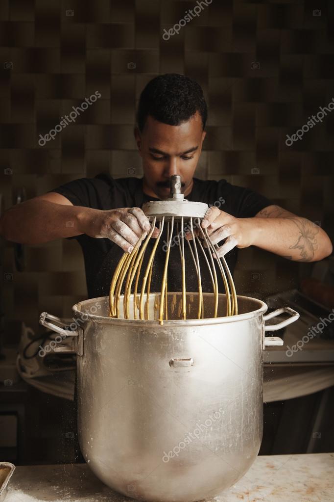 Cook with big cooking pot in the kitchen, Stock Photo, Picture And