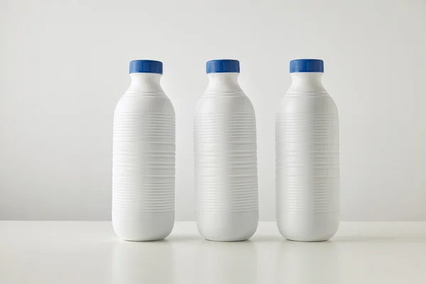 white plastic bottles with blue caps