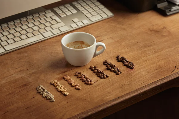 Coffee beans showing seven various stages of roasting — Stock Photo, Image