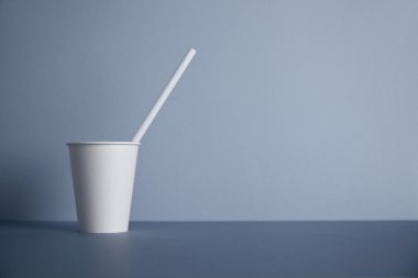 White paper cups isolated on gray