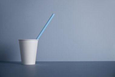 White paper cups isolated on gray