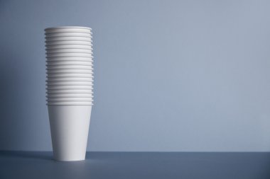 white paper cups folded one in other in bunch